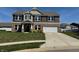 Attractive two-story home featuring a brick and siding exterior, complete with a two-car garage at 2068 Deer Valley Ct, Columbus, IN 47201