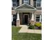 Inviting front porch with decorative wreath and welcoming landscaping, enhancing curb appeal at 2068 Deer Valley Ct, Columbus, IN 47201