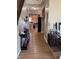 Hallway with hardwood floors, showcasing the home's open layout and stylish decor at 2068 Deer Valley Ct, Columbus, IN 47201
