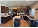 Well-lit kitchen featuring dark wood cabinetry, stainless steel appliances, and a center island at 2068 Deer Valley Ct, Columbus, IN 47201