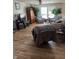 Bright living room featuring a ceiling fan, hardwood floors, and plenty of natural light at 2068 Deer Valley Ct, Columbus, IN 47201