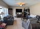 Inviting living room featuring plush seating, a large television, and built-in shelving at 2068 Deer Valley Ct, Columbus, IN 47201
