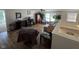 Bright living room featuring a ceiling fan, hardwood floors, and plenty of natural light at 2068 Deer Valley Ct, Columbus, IN 47201
