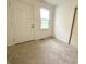 Small bedroom with one window and a large sliding closet door at 223 E 53Rd St, Anderson, IN 46013