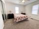 Bright bedroom with a double bed, carpeted floor, and two windows providing natural light at 223 E 53Rd St, Anderson, IN 46013