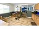 Well-lit kitchen featuring stainless steel appliances, wood cabinets, and new laminate flooring at 223 E 53Rd St, Anderson, IN 46013