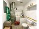 Well-equipped utility room featuring a new furnace and water heater, offering modern efficiency and reliability at 223 E 53Rd St, Anderson, IN 46013