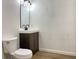 This bathroom features a modern vanity with stylish fixtures and a toilet at 3019 Knobstone Ln, Indianapolis, IN 46203