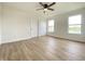 A spacious bedroom featuring wood flooring, ample natural light and large double door closet at 3019 Knobstone Ln, Indianapolis, IN 46203
