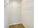 Walk-in closet with wire shelving and wood-look flooring at 3019 Knobstone Ln, Indianapolis, IN 46203