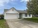 Charming one-story home featuring a front-facing garage and a well-maintained front yard at 3019 Knobstone Ln, Indianapolis, IN 46203