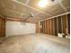 Spacious unfinished garage with a white door at 3019 Knobstone Ln, Indianapolis, IN 46203
