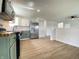 Modern kitchen featuring stainless steel appliances, white upper cabinets, and green lower cabinets at 3019 Knobstone Ln, Indianapolis, IN 46203