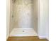 Close up of the new tiled shower with a white base at 3019 Knobstone Ln, Indianapolis, IN 46203