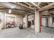 Unfinished basement showing concrete floors, utilities, and exposed ductwork at 328 N Layman Ave, Indianapolis, IN 46219