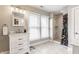 Bright bathroom with marble counters, a shower and white shaker-style vanity at 328 N Layman Ave, Indianapolis, IN 46219