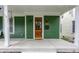 Inviting front porch with wooden door, overhead lighting, and attractive house number at 328 N Layman Ave, Indianapolis, IN 46219