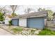 Three-car detached garage with blue doors at 328 N Layman Ave, Indianapolis, IN 46219