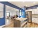 Open-concept kitchen offers stainless appliances and a clear view to the dining and living spaces at 328 N Layman Ave, Indianapolis, IN 46219