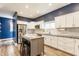Well-appointed kitchen featuring a center island, stainless appliances, and ample cabinet space at 328 N Layman Ave, Indianapolis, IN 46219