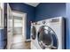 Laundry room featuring modern front-loading washer and dryer at 328 N Layman Ave, Indianapolis, IN 46219