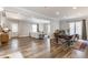Open-concept living area showcases hardwood floors, modern furniture, and bright natural light at 328 N Layman Ave, Indianapolis, IN 46219