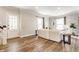Bright living room with hardwood floors and a staircase at 328 N Layman Ave, Indianapolis, IN 46219