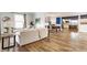 Open-concept living room featuring hardwood floors and abundant natural light at 328 N Layman Ave, Indianapolis, IN 46219