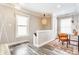 Bright sitting area features hardwood floors, windows, overhead lighting, and comfortable furniture at 328 N Layman Ave, Indianapolis, IN 46219