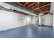 Unfinished basement with exposed ductwork, painted floor, and ample space for storage or future customization at 335 N Franklin Rd, Indianapolis, IN 46219