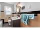 Charming bathroom featuring vintage tile work, updated vanity, and natural light from the window at 335 N Franklin Rd, Indianapolis, IN 46219