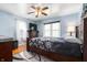 Calm bedroom with a large bed, soft blue walls, and natural light, creating a peaceful retreat at 335 N Franklin Rd, Indianapolis, IN 46219