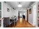 Bright dining area features hardwood floors, neutral decor, and seamless transition to the living room at 335 N Franklin Rd, Indianapolis, IN 46219