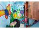 Bright playroom filled with creative art and a comfortable beanbag for relaxation and fun at 335 N Franklin Rd, Indianapolis, IN 46219