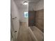 Bathroom features a toilet, tub, shower, and window at 3629 Birchwood Ave, Indianapolis, IN 46205