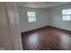Bedroom with wood floors and new windows at 3629 Birchwood Ave, Indianapolis, IN 46205