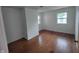 Bedroom with hardwood floors and new windows at 3629 Birchwood Ave, Indianapolis, IN 46205