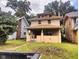 Charming two-story home with a covered front porch and landscaped front yard at 3629 Birchwood Ave, Indianapolis, IN 46205