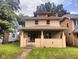 Charming two-story home with a covered front porch and landscaped front yard at 3629 Birchwood Ave, Indianapolis, IN 46205