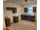 New kitchen features dark cabinets, granite countertops, and stainless steel sink at 3629 Birchwood Ave, Indianapolis, IN 46205