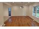 Spacious dining area with hardwood floors, chandelier, and ample natural light at 3629 Birchwood Ave, Indianapolis, IN 46205