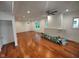 Open living area with ceiling fan, recessed lighting, and gleaming hardwood floors at 3629 Birchwood Ave, Indianapolis, IN 46205