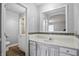 Bathroom vanity with mosaic backsplash and updated lighting at 4044 Roamin Dr, Greenwood, IN 46142