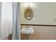 Cozy bathroom featuring a classic vanity with a framed mirror and natural light at 4044 Roamin Dr, Greenwood, IN 46142