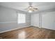 Bedroom with hardwood floors, ceiling fan, and natural light from the window at 4044 Roamin Dr, Greenwood, IN 46142