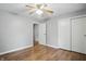 Cozy bedroom featuring hardwood floors and ceiling fan at 4044 Roamin Dr, Greenwood, IN 46142