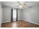 Bedroom with hardwood floors, natural light, and updated gray paint at 4044 Roamin Dr, Greenwood, IN 46142