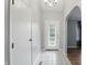 Bright foyer featuring tile flooring, a decorative glass front door, and a view into the living spaces at 4044 Roamin Dr, Greenwood, IN 46142