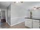 Kitchen features white cabinets, an eat-in bar and access to laundry room at 4044 Roamin Dr, Greenwood, IN 46142