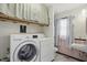 Bright laundry room with modern appliances and storage, offering convenience and functionality at 4044 Roamin Dr, Greenwood, IN 46142
